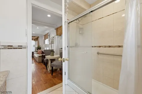 a bedroom with a bed dresser and a window