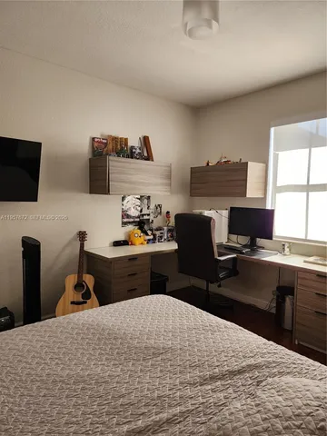 a view of patio with couches and a fire pit