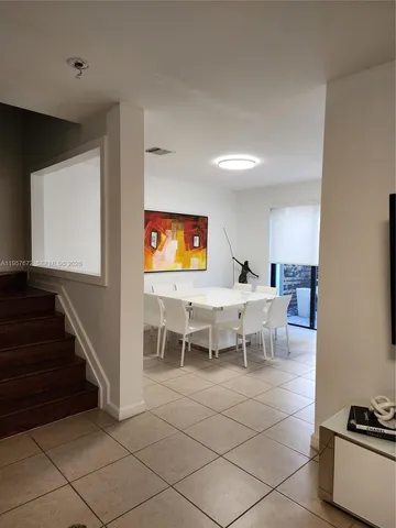 a kitchen with stainless steel appliances granite countertop a stove a refrigerator a sink a microwave and a refrigerator