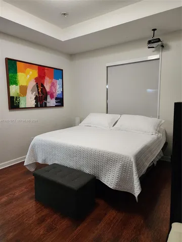 a bathroom with double sink and a mirror