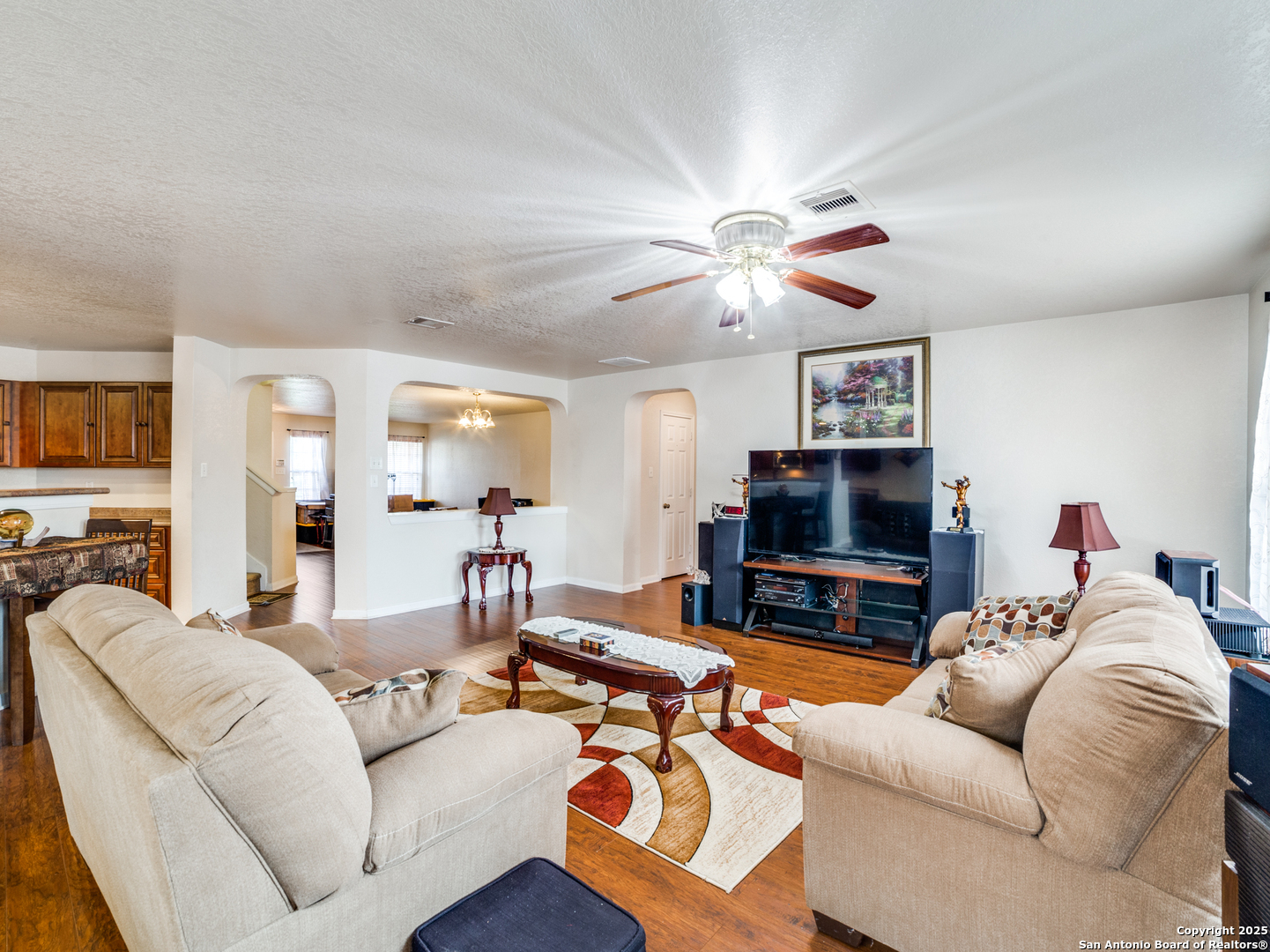 212 Springtree Trail Cibolo, TX 78108 - Photo 15 of 28 a living room with furniture a flat screen tv and a fireplace