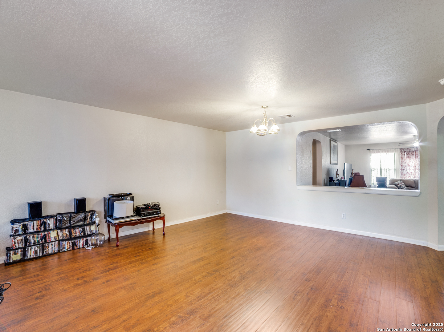 212 Springtree Trail Cibolo, TX 78108 - Photo 3 of 28 a view of a kitchen with furniture and wooden floor