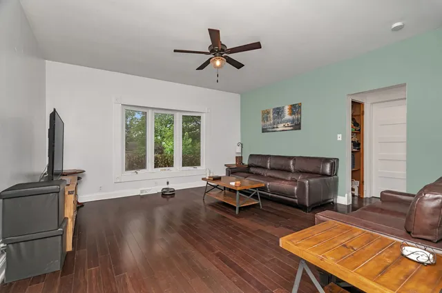 a living room with furniture and a window