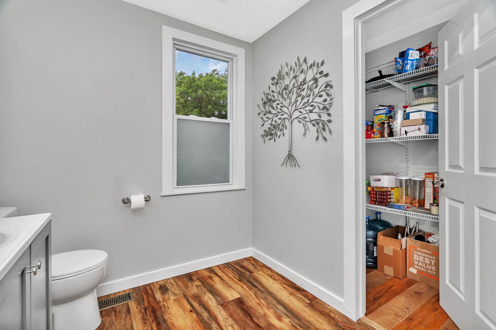 313 East George Street Odell, IL 60460 - Photo 22 of 44 a bathroom with a toilet and a book shelf