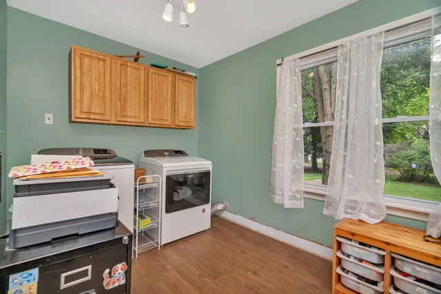 a view of room with window and wooden floor
