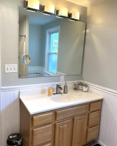 a bathroom with a sink and a mirror