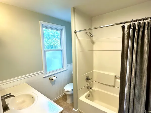 a bathroom with a sink and a bathtub