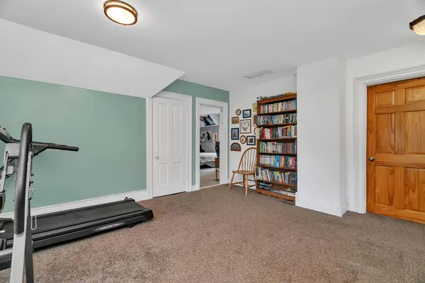 a view of an empty room with closet area