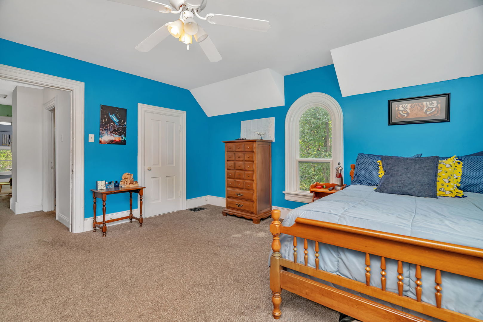 313 East George Street Odell, IL 60460 - Photo 40 of 44 a bedroom with a bed and a chandelier