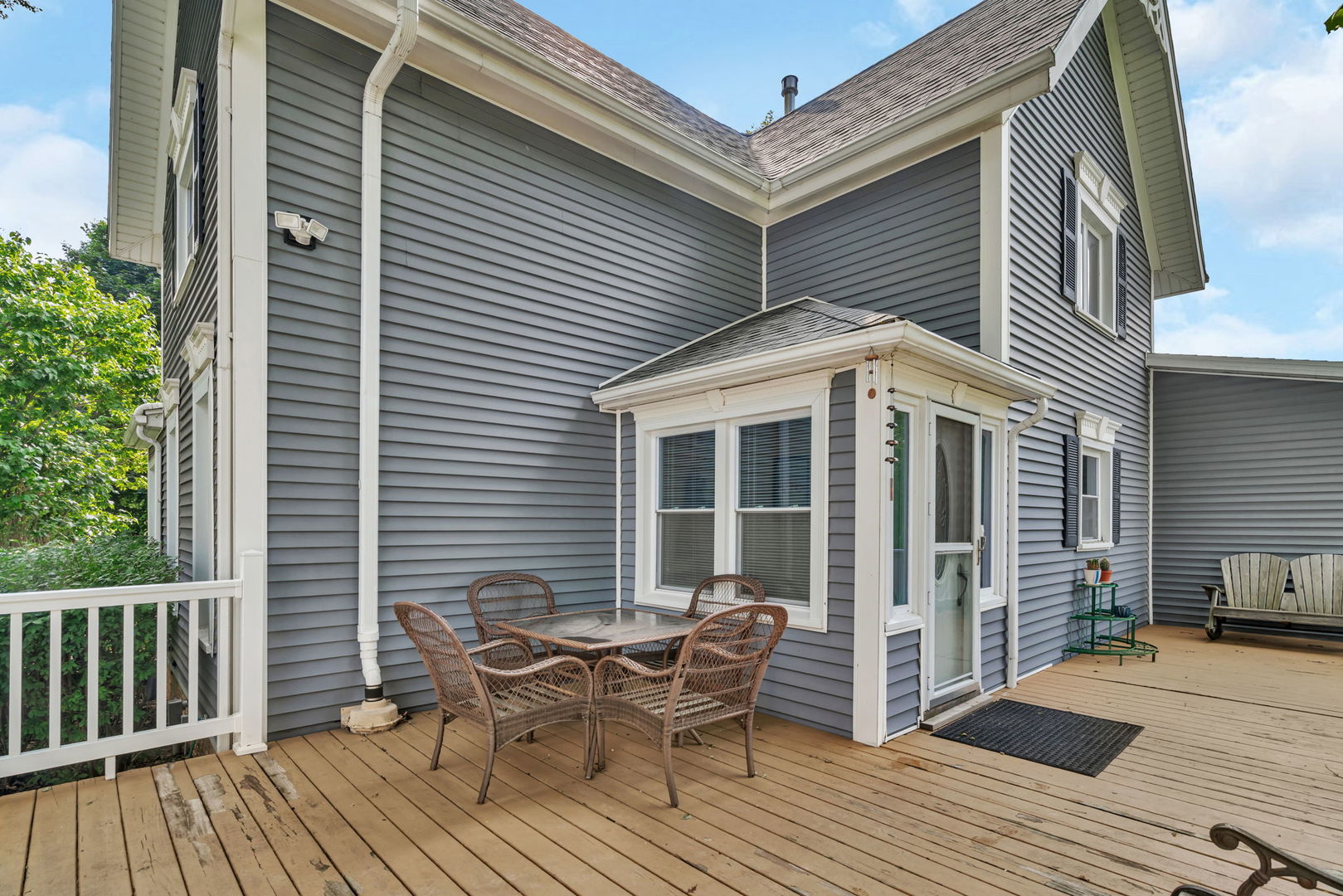 313 East George Street Odell, IL 60460 - Photo 6 of 44 a view of a house with a deck and furniture