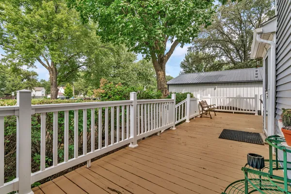 a view of deck with wooden floor and fence