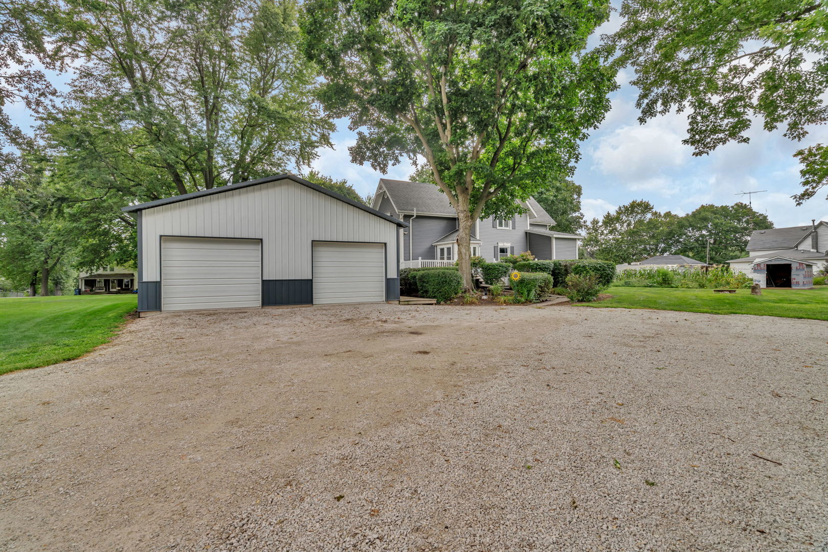 313 East George Street Odell, IL 60460 - Photo 10 of 44 a front view of a house with a yard and garage