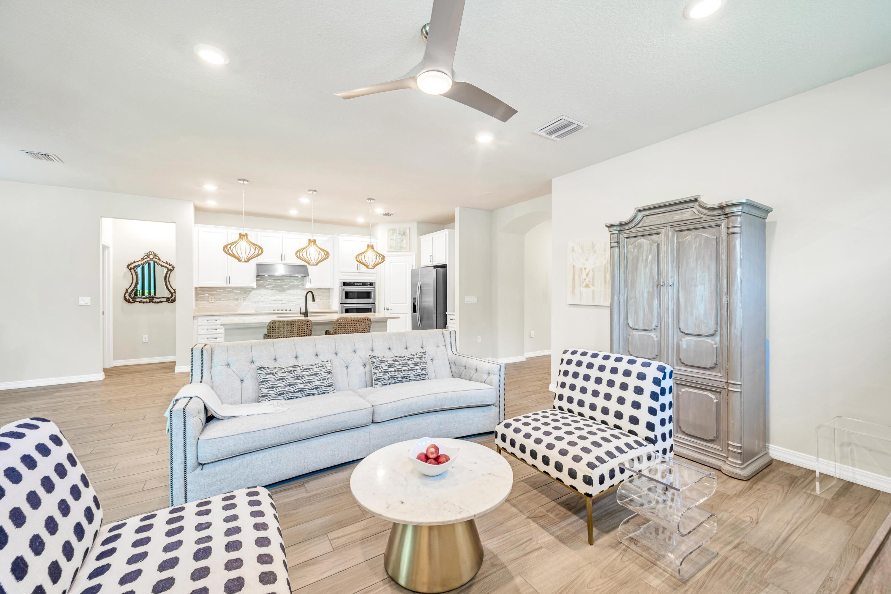 8028 Northwest 78th Street Tamarac, FL 33321 - Photo 23 of 38 a living room with furniture and a rug