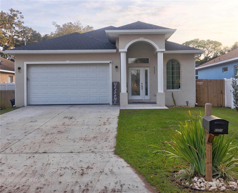 a view of a house with a yard