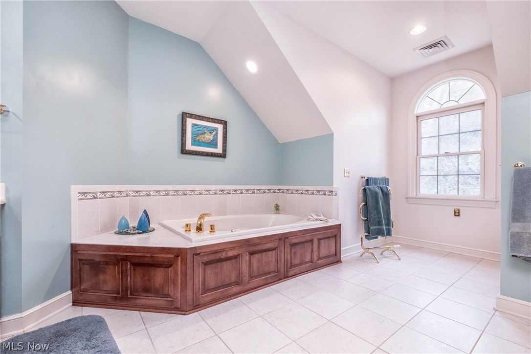 2815 Westdale Road Northwest Canton, OH 44708 - Photo 21 of 33 Second floor Master bath jetted tub with tile surround. Not e the recessed lighting and tile surround.