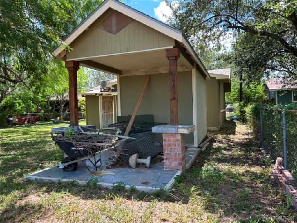 1104 Esperanza Road Alamo, TX 78516 - Photo 16 of 21 a front view of house with backyard and outdoor seating