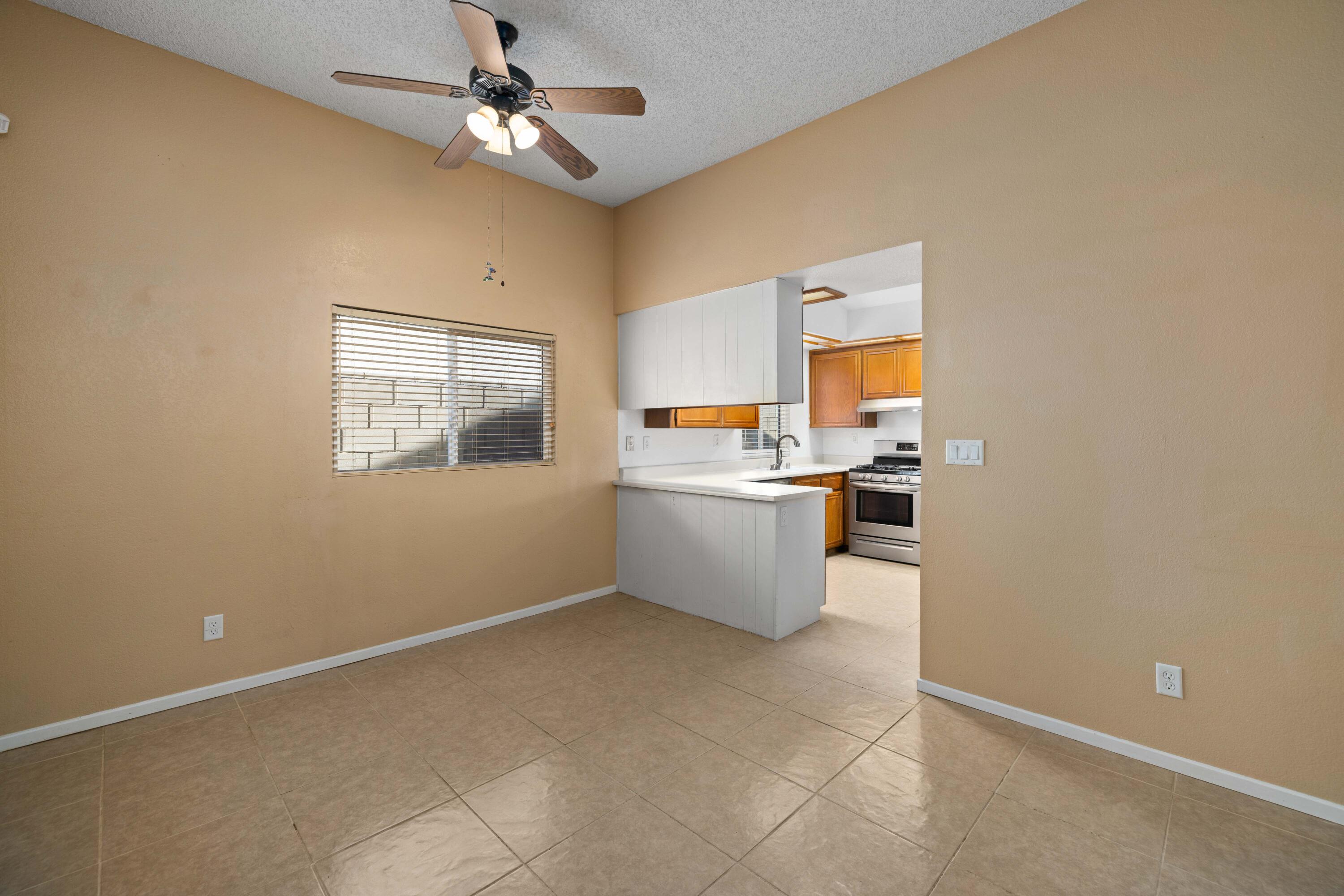 3043 Echo Drive Rosamond, CA 93560 - Photo 11 of 24 a view of a kitchen with a sink cabinets and window