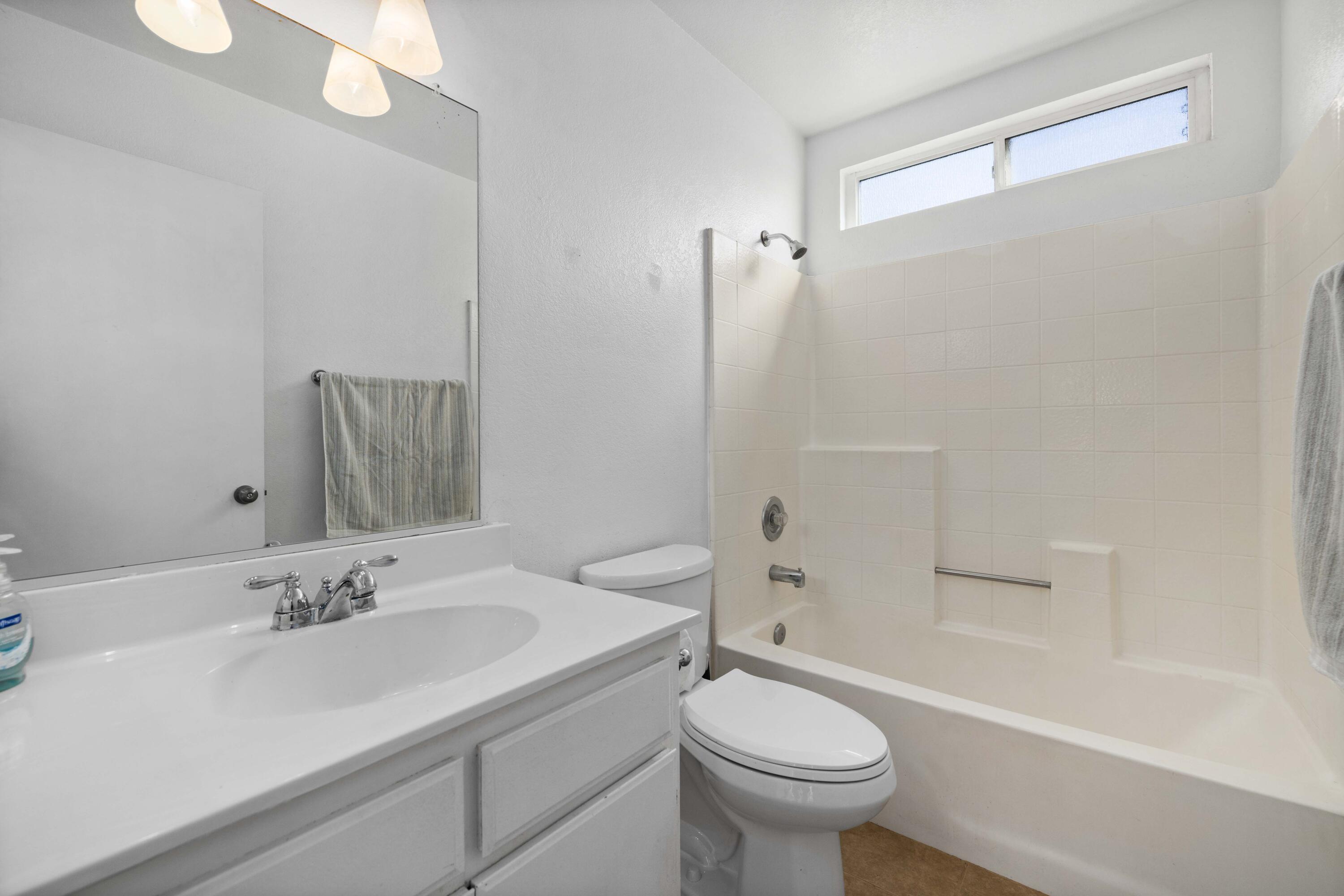 3043 Echo Drive Rosamond, CA 93560 - Photo 19 of 24 a bathroom with a sink toilet tub and shower