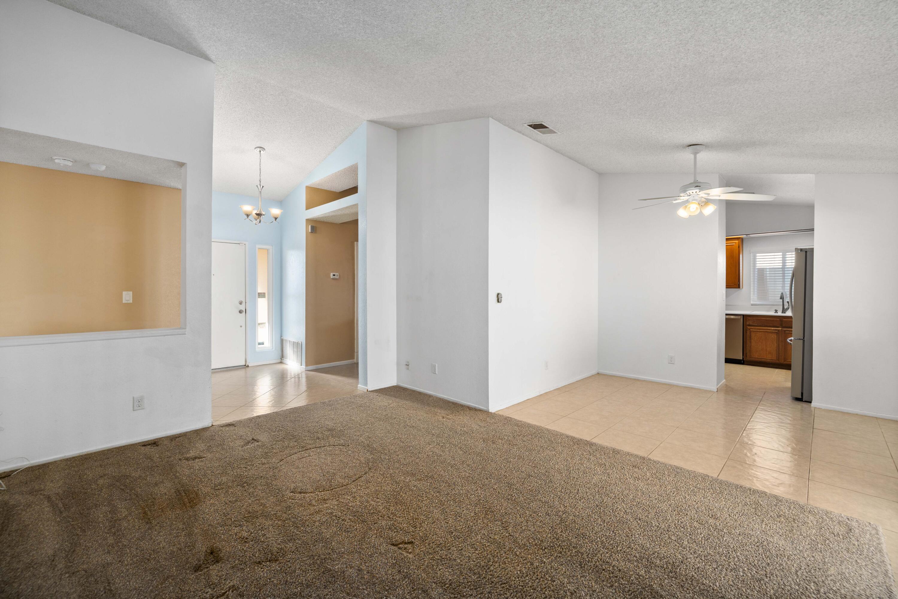 3043 Echo Drive Rosamond, CA 93560 - Photo 4 of 24 a view of a big room with wooden floor and windows