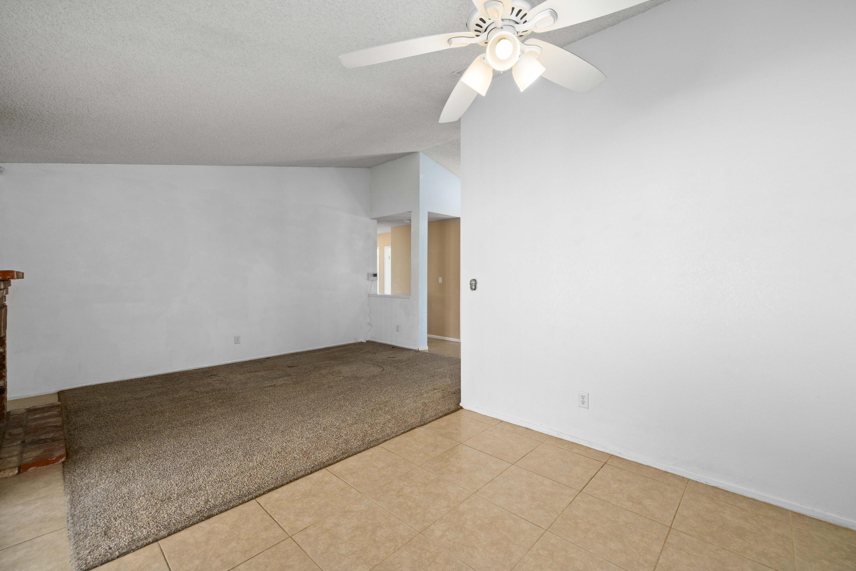 3043 Echo Drive Rosamond, CA 93560 - Photo 5 of 24 an empty room with a fan and a fan