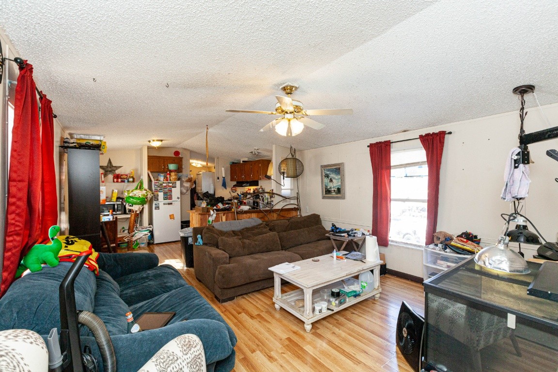 9312 Missionary Ridge Road Bon Aqua, TN 37025 - Photo 11 of 42 a living room with furniture and a chandelier