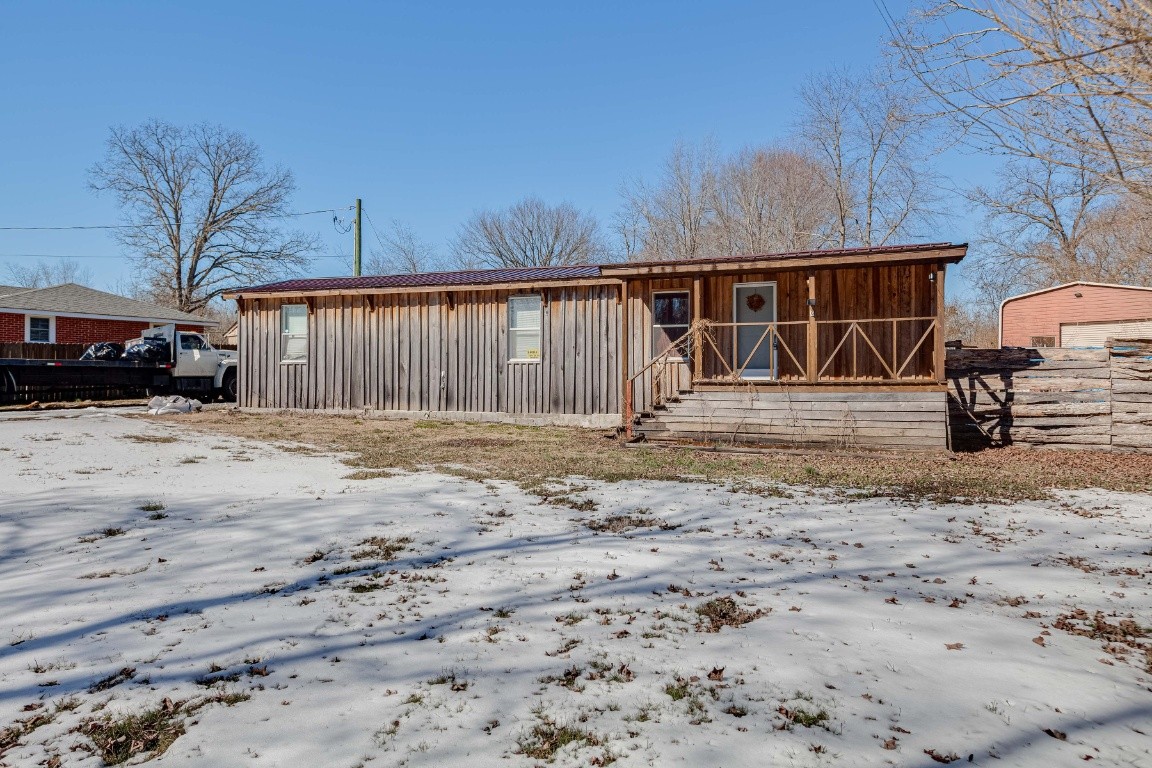 9312 Missionary Ridge Road Bon Aqua, TN 37025 - Photo 13 of 42 a front view of a house with a yard