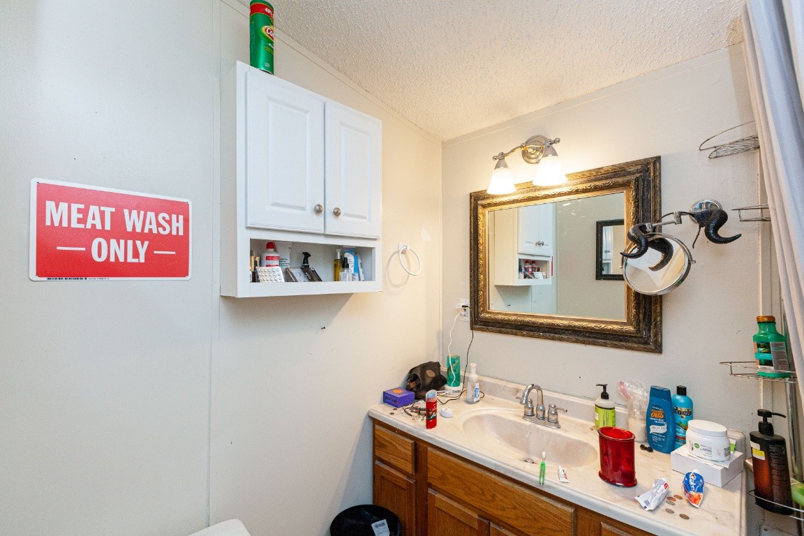 9312 Missionary Ridge Road Bon Aqua, TN 37025 - Photo 19 of 42 a bathroom with a sink and a mirror