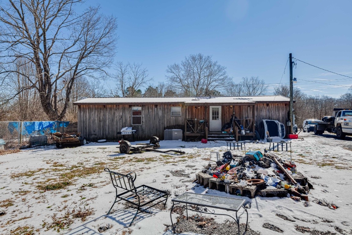 9312 Missionary Ridge Road Bon Aqua, TN 37025 - Photo 29 of 42 a view of backyard with seating space and wooden fence