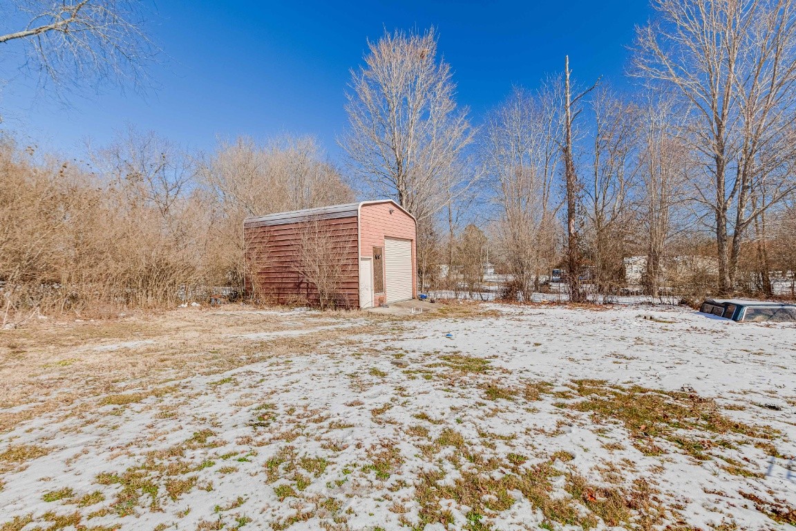 9312 Missionary Ridge Road Bon Aqua, TN 37025 - Photo 34 of 42 a view of a yard covered in snow
