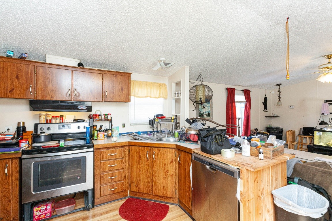 9312 Missionary Ridge Road Bon Aqua, TN 37025 - Photo 6 of 42 a kitchen with a sink cabinets and appliances