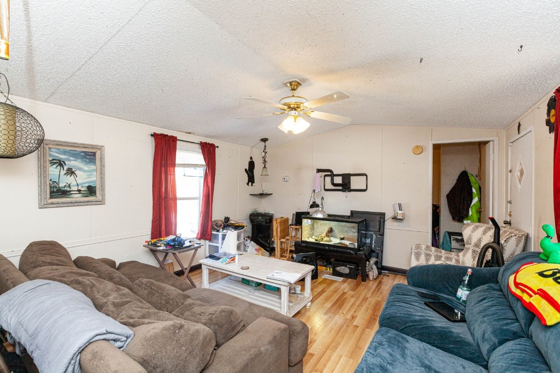 9312 Missionary Ridge Road Bon Aqua, TN 37025 - Photo 8 of 42 a living room with furniture a couch and a chandelier
