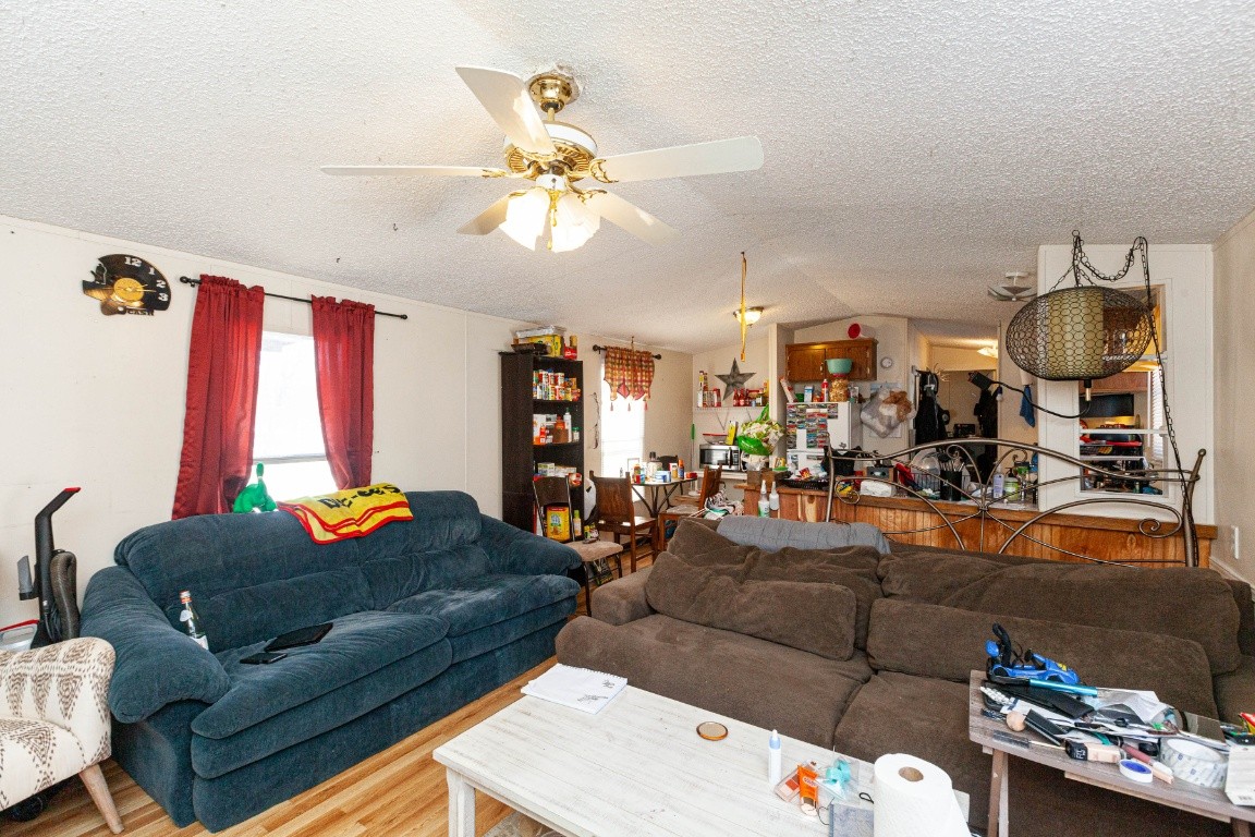 9312 Missionary Ridge Road Bon Aqua, TN 37025 - Photo 10 of 42 a living room with furniture and a chandelier