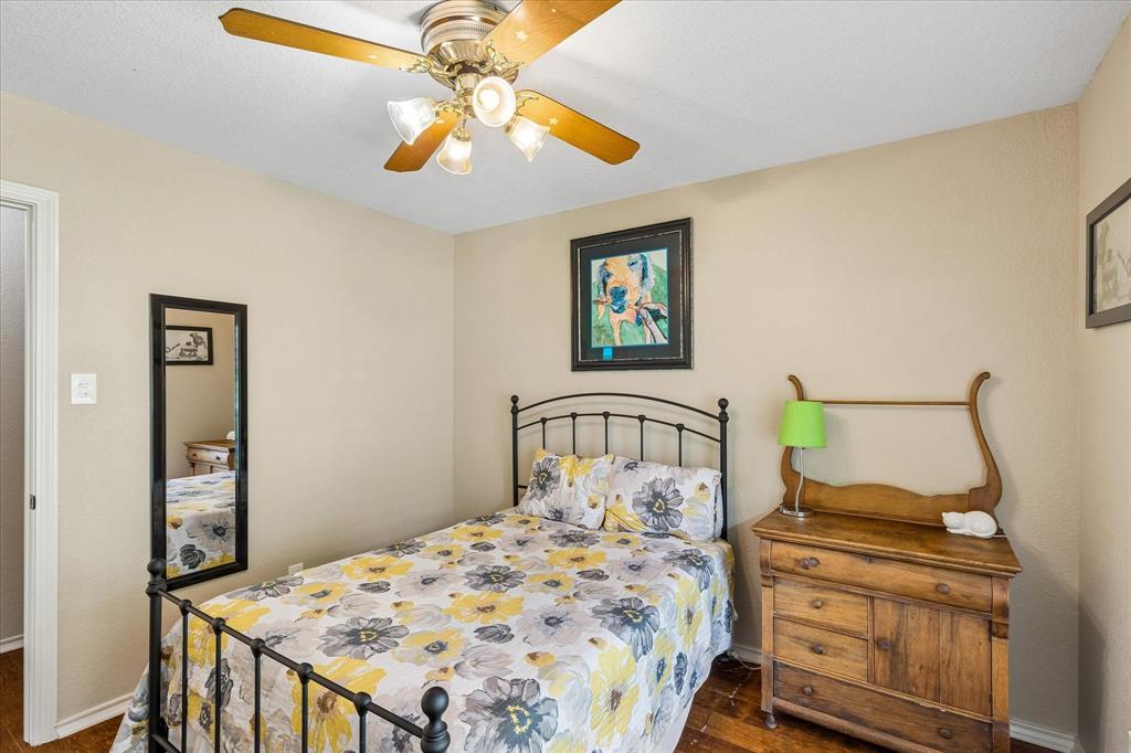 404 Moonlight Lane Keller, TX 76248 - Photo 26 of 40 a bedroom with a bed and a chandelier