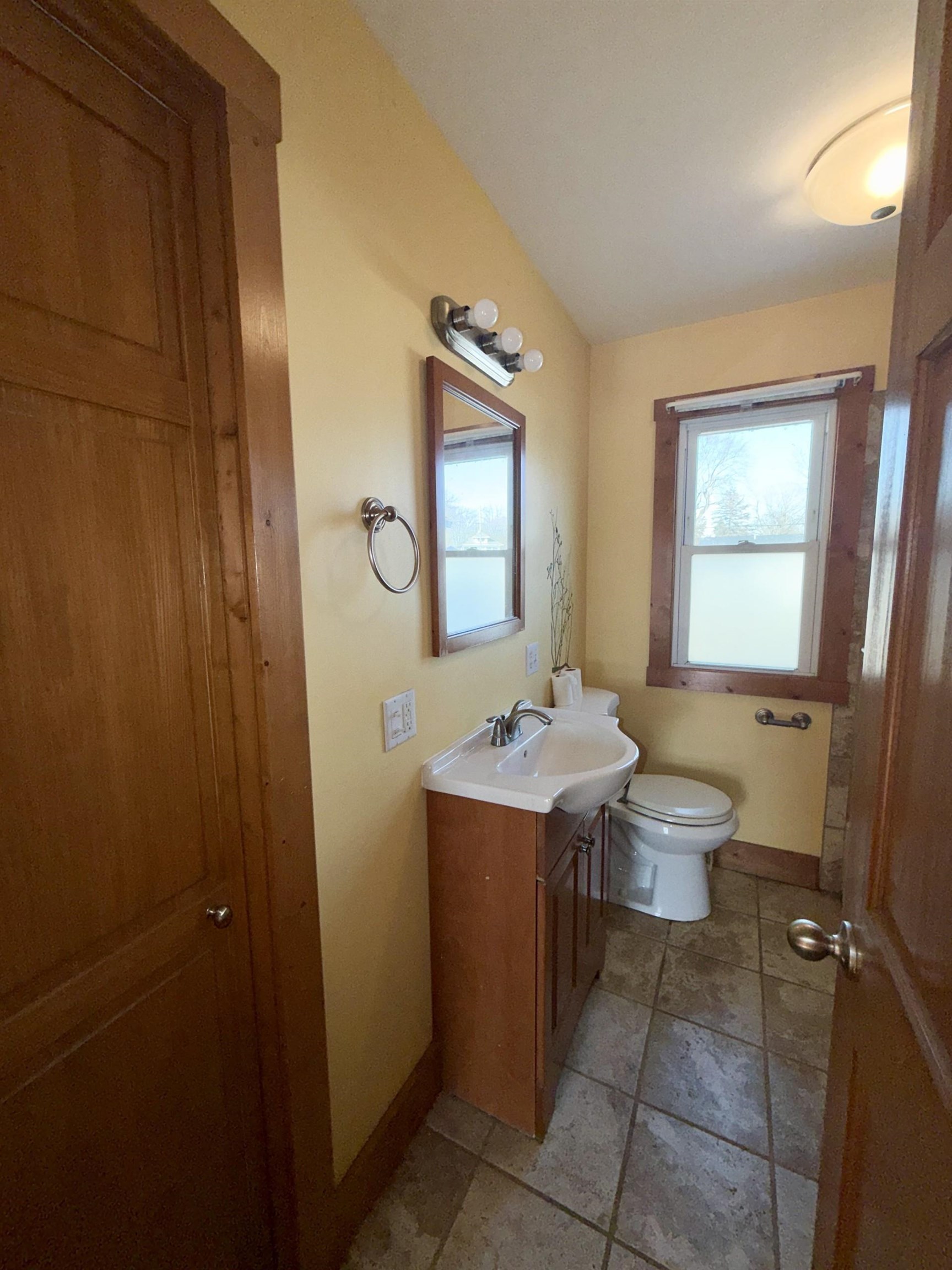 716 Viaduct Road Savanna, IL 61074 - Photo 11 of 19 a bathroom with a sink a toilet and mirror