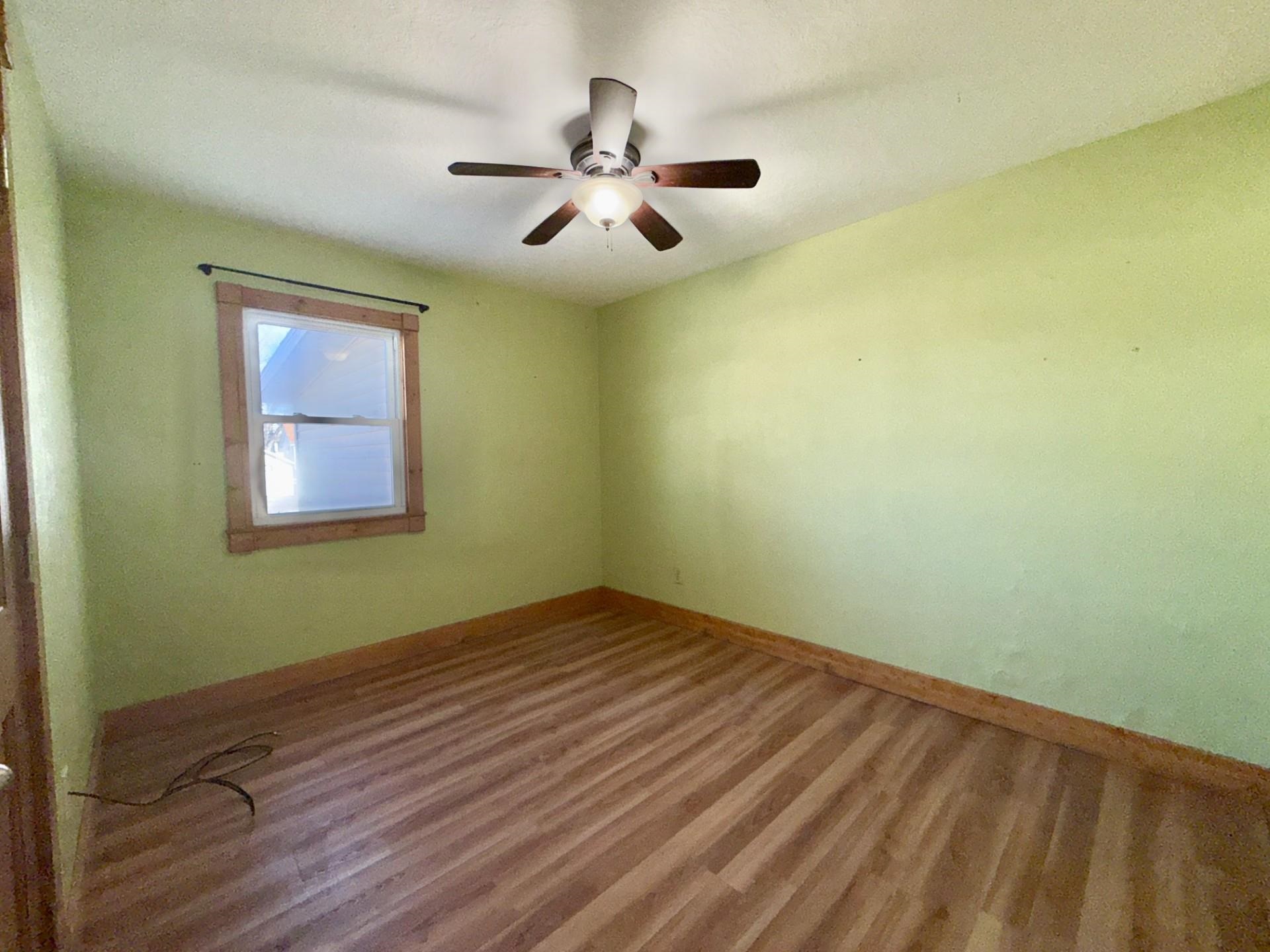 716 Viaduct Road Savanna, IL 61074 - Photo 13 of 19 wooden floor in an empty room