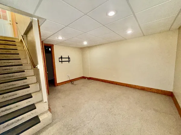 a view of a room with wooden walls