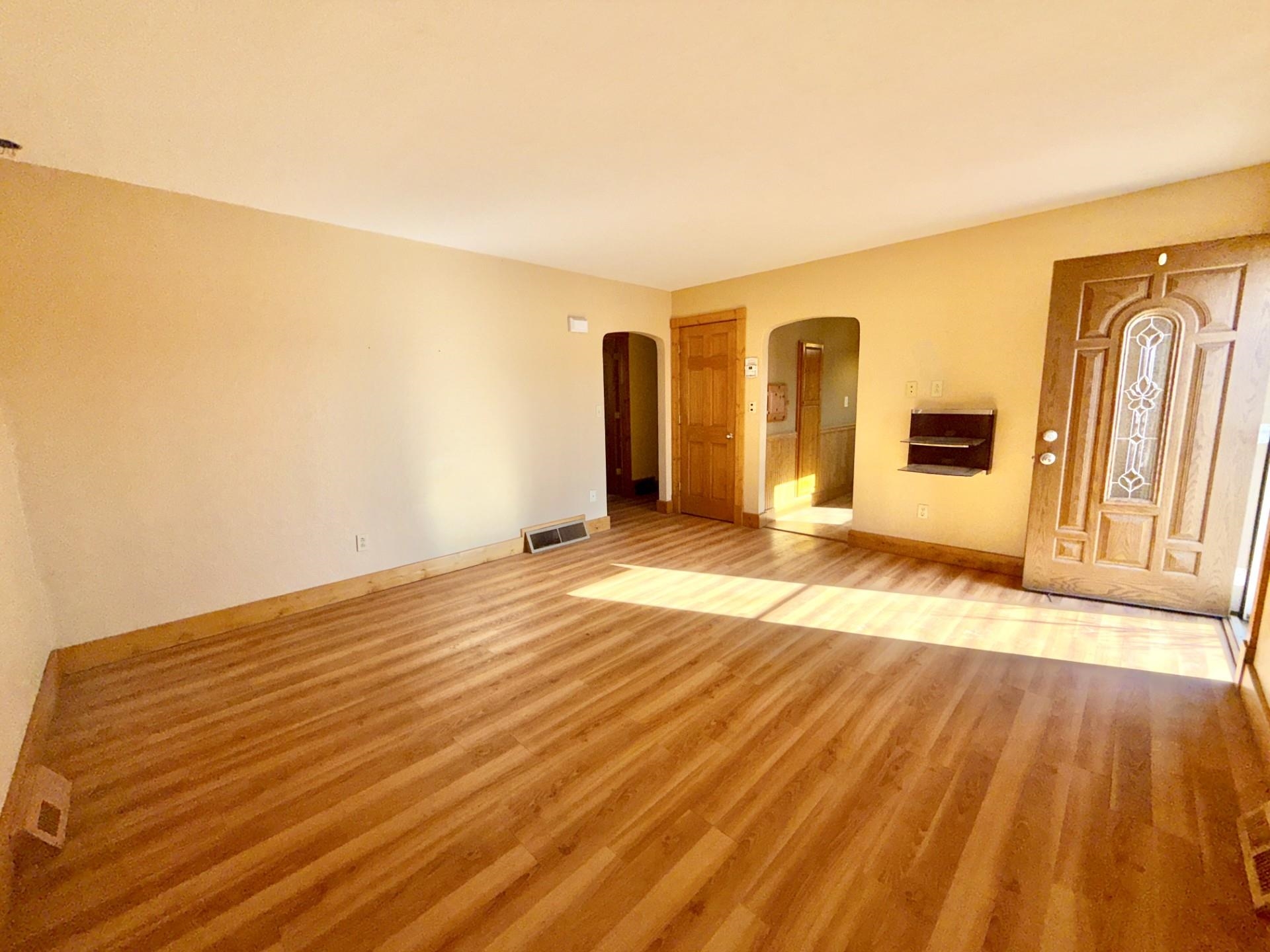 716 Viaduct Road Savanna, IL 61074 - Photo 9 of 19 a view of a livingroom with wooden floor