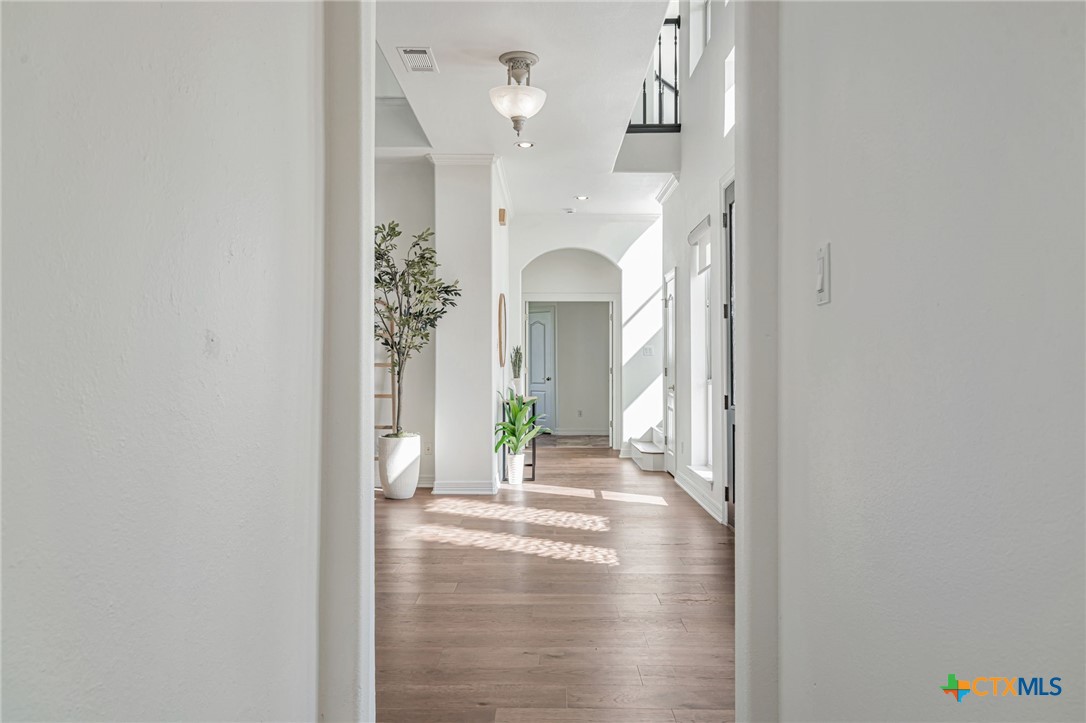 200 Tovas Secret Cove Georgetown, TX 78628 - Photo 11 of 31 a view of a hallway with interior of the house