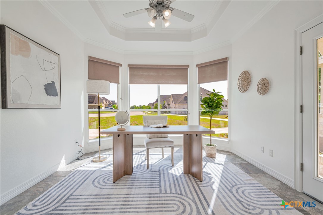 200 Tovas Secret Cove Georgetown, TX 78628 - Photo 12 of 31 a view of a dining room with furniture a chandelier and wooden floor