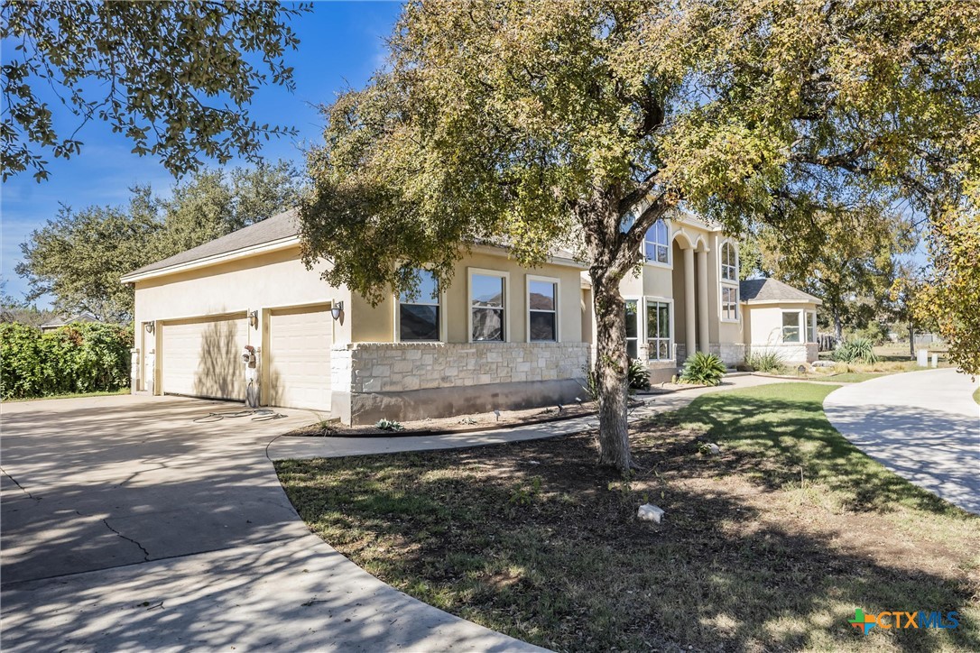200 Tovas Secret Cove Georgetown, TX 78628 - Photo 2 of 31 a front view of a house with a yard