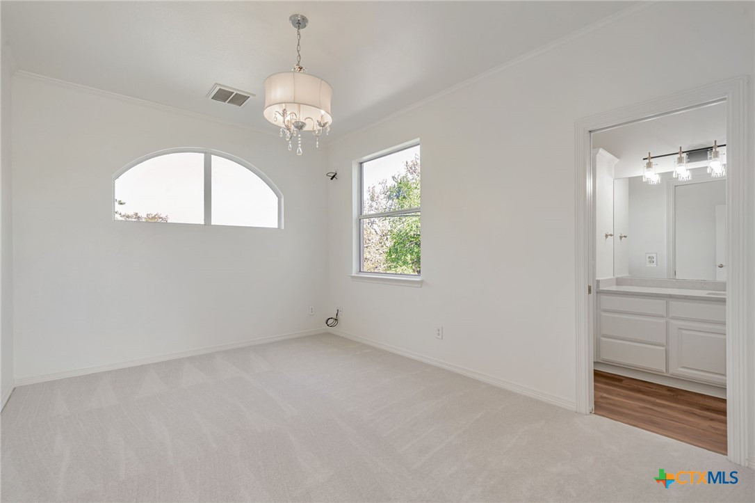 200 Tovas Secret Cove Georgetown, TX 78628 - Photo 22 of 31 wooden floor in an empty room with a window