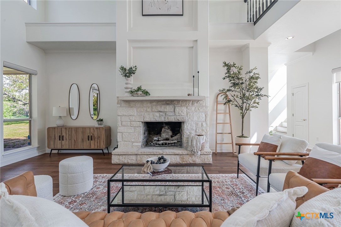 200 Tovas Secret Cove Georgetown, TX 78628 - Photo 6 of 31 a living room with furniture and a fireplace