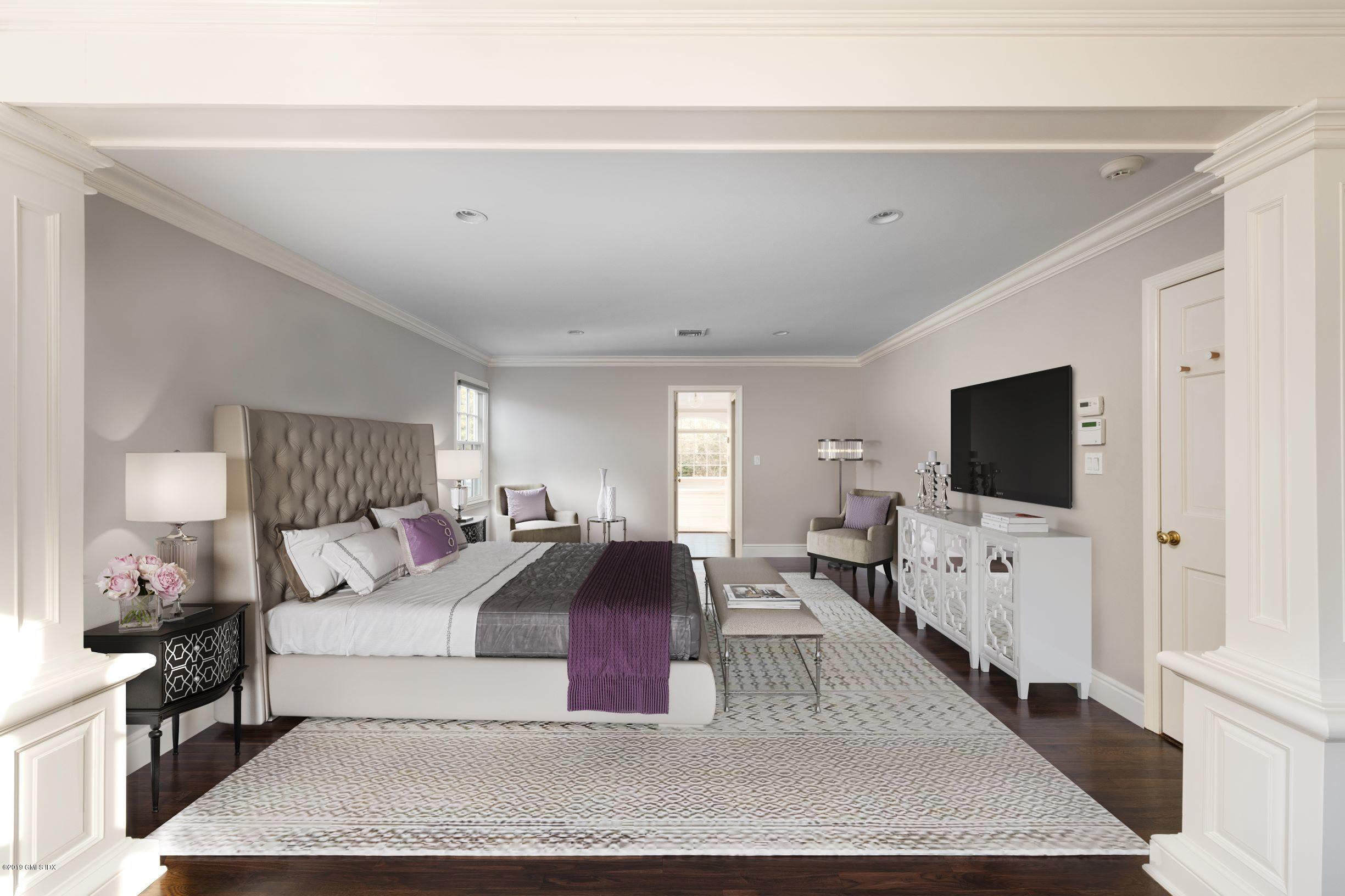 35 Copper Beech Road Greenwich, CT 06830 - Photo 11 of 26 a large bedroom with a bed and flat tv screen on dresser