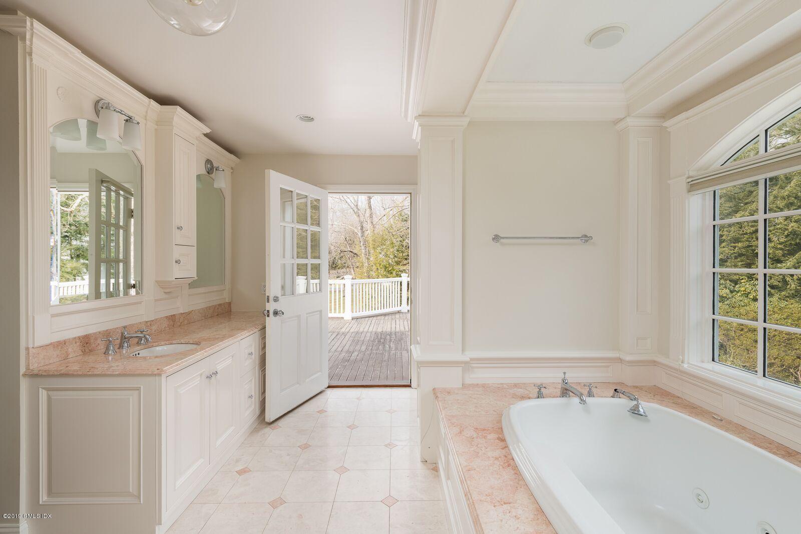 35 Copper Beech Road Greenwich, CT 06830 - Photo 13 of 26 a spacious bathroom with a tub sink and mirror