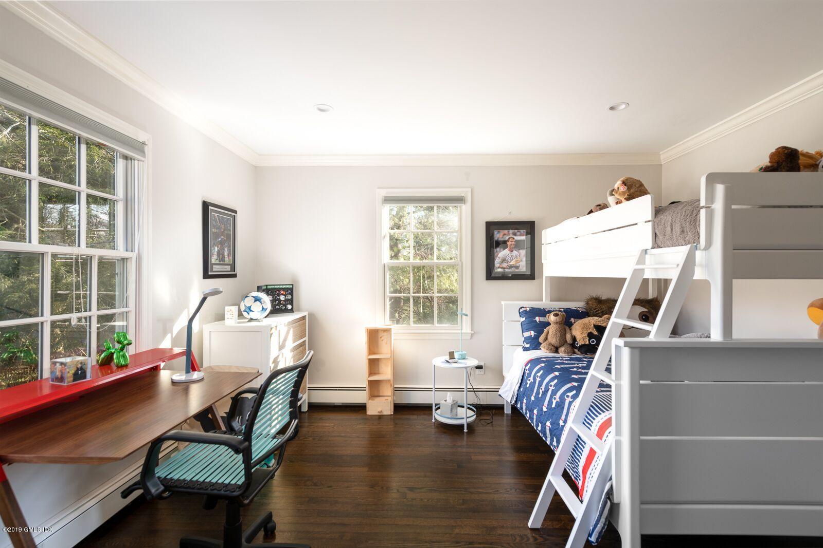 35 Copper Beech Road Greenwich, CT 06830 - Photo 15 of 26 a bedroom with furniture and a window