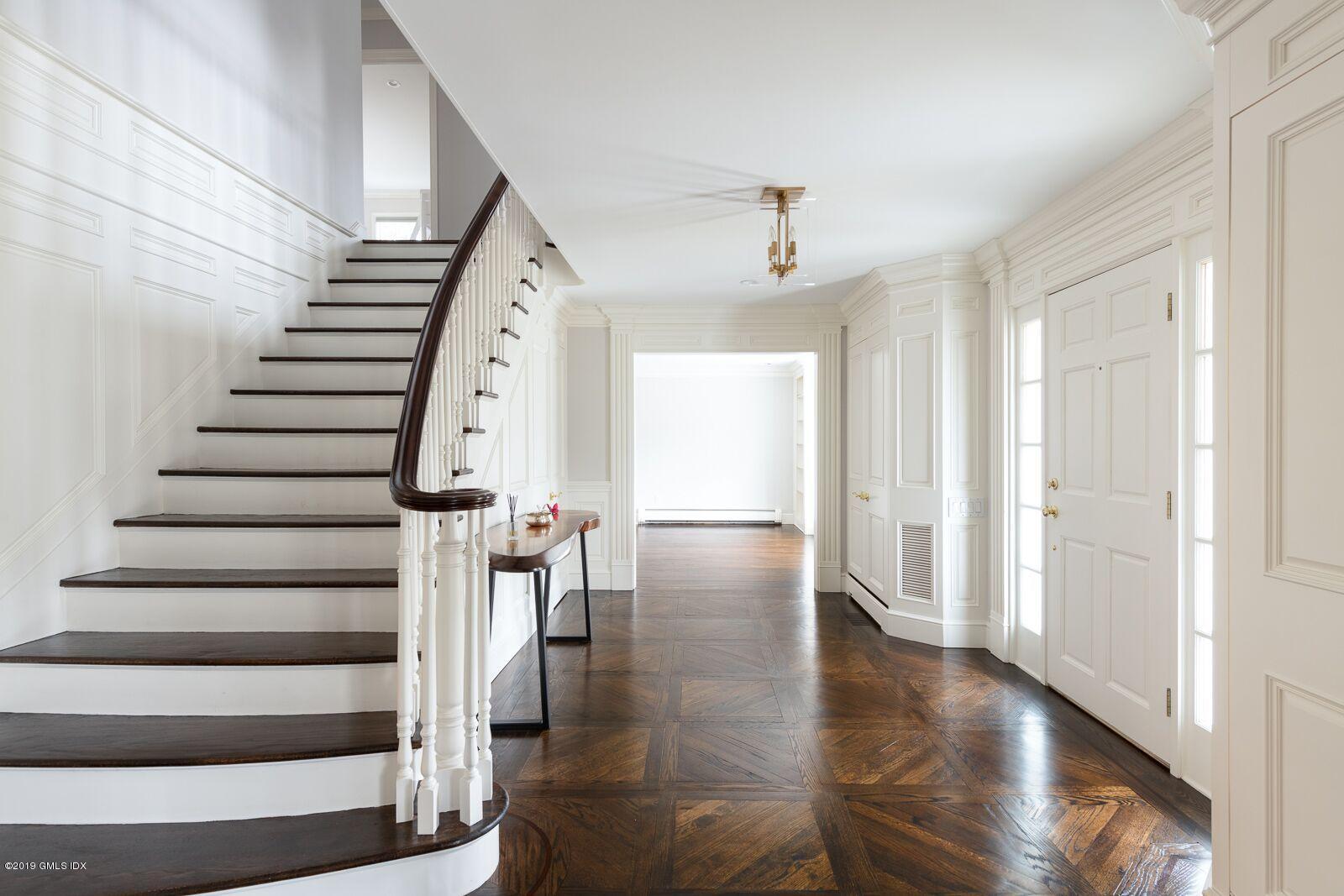 35 Copper Beech Road Greenwich, CT 06830 - Photo 9 of 26 a view of entryway with wooden floor and stairs