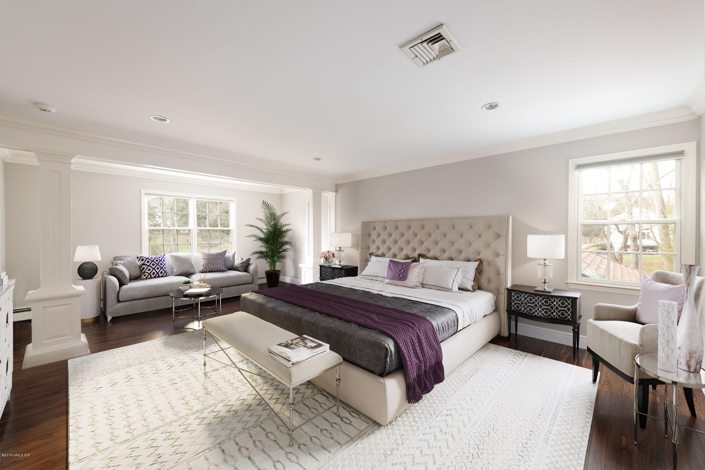 35 Copper Beech Road Greenwich, CT 06830 - Photo 10 of 26 a bedroom with a bed couch and a window