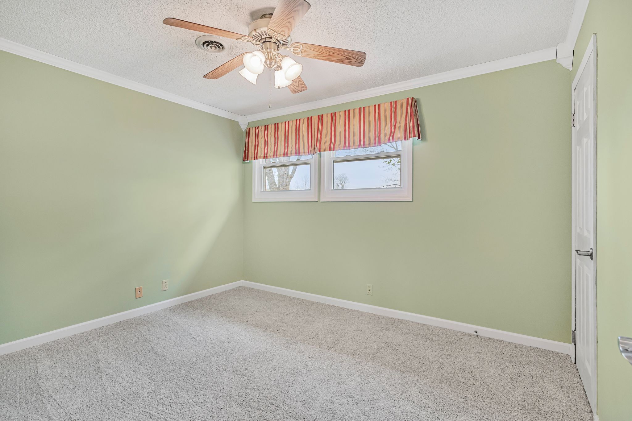 460 West Campbell Road Goodlettsville, TN 37072 - Photo 13 of 55 an empty room with windows and fan