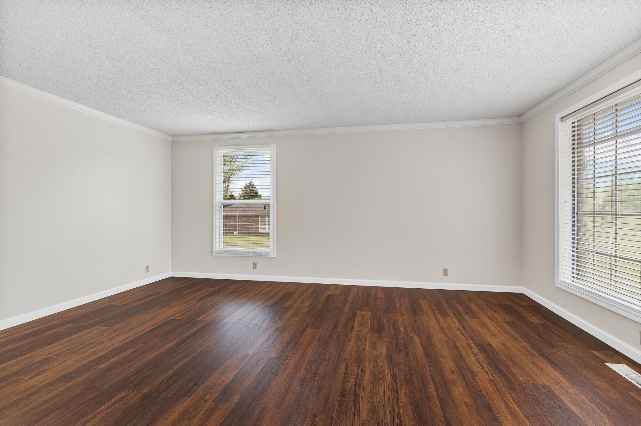 460 West Campbell Road Goodlettsville, TN 37072 - Photo 19 of 55 an empty room with wooden floor and windows