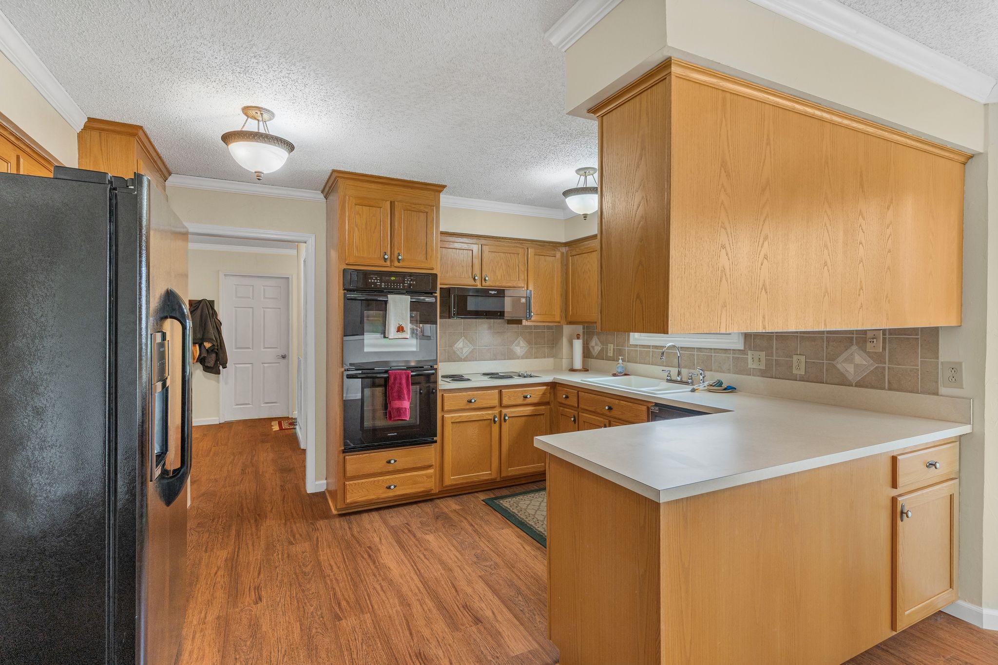 460 West Campbell Road Goodlettsville, TN 37072 - Photo 25 of 55 a kitchen that has a lot of cabinets in it and wooden floors